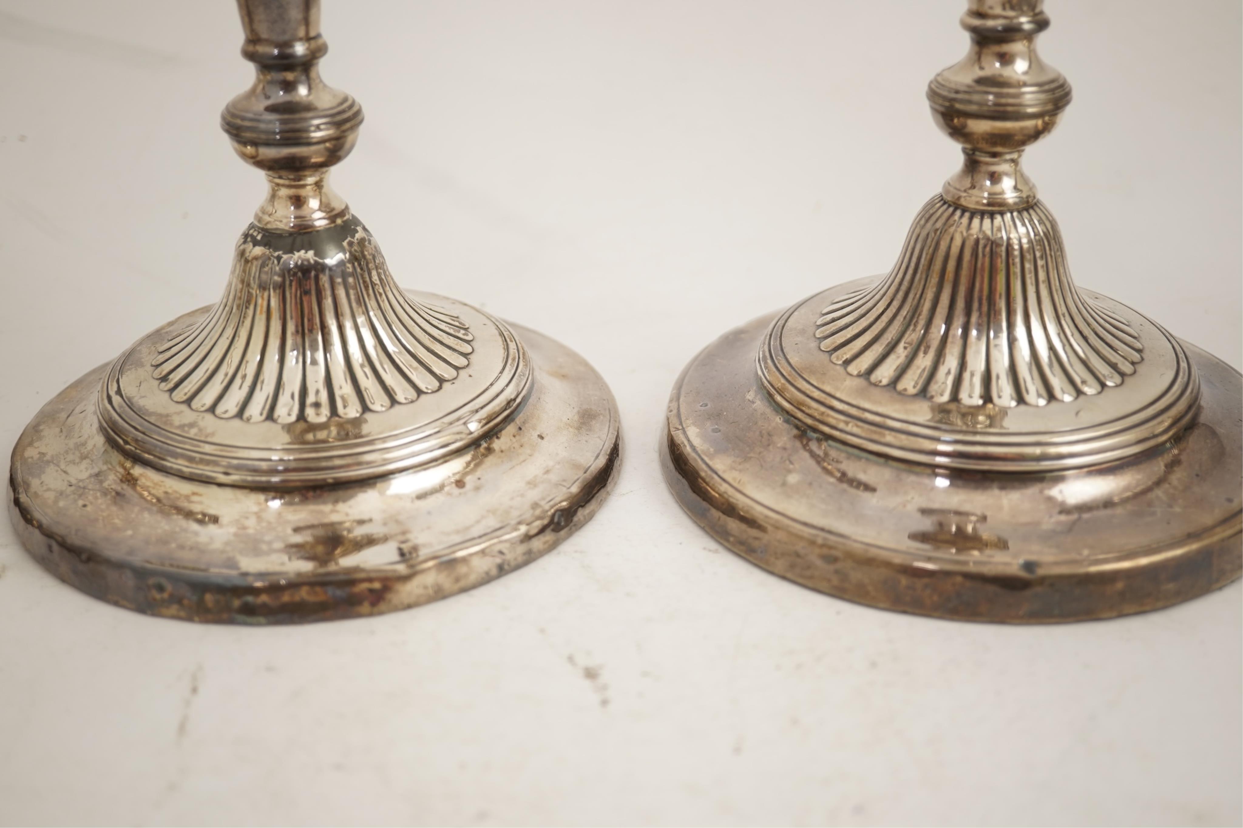 A set of four George III silver candlesticks by John Green, Roberts, Mosley & Co